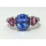 A tanzanite and pink sapphire 3 stone ring, finger size M/N.