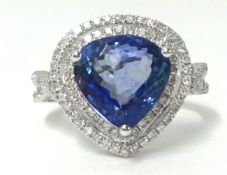 A 14k white gold and diamond ring set with a pear cut tanzanite, approx 4.00 carats, diamonds approx