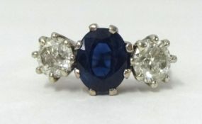 A good diamond and sapphire three stone ring, each stone approx 1.00 carat, finger size M 1/2.