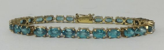 9ct gold tennis bracelet with 10ct of blue topaz