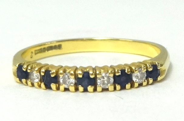 An 18ct diamond and sapphire ring, finger size P.