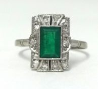 An 18ct yellow gold and platinum emerald and diamond set cluster ring, finger size O.