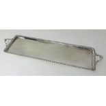 R.H.Halford & Sons, Pall Mall, London, a silver oblong tray with handles and a patterned border,