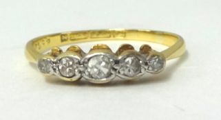 A platinum five stone diamond ring circa 1920 (small cut diamonds).