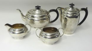 A Geo V four piece silver service comprising teapot, coffee pot, milk jug and sugar bowl, combined