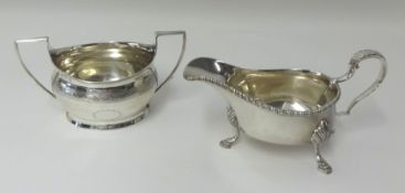 An Edwardian silver sauceboat and a two handled sugar bowl, combined weight approx 16.30oz..