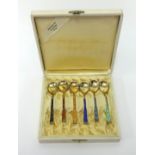 A Norwegian sterling silver set of six enamelled tea spoons, cased.