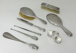 Silver backed hair brush, mirror, clothes brush, button hook and shoe horn, also 3 napkin rings