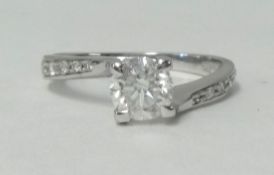 A white gold diamond solitaire ring, approx 0.95 carat (four prong).