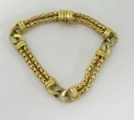 An 18k gold bracelet, stamped Italy, approx 25.80g.