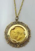 A Geo V 1914 gold sovereign, mounted in gold as a pendant with chain.