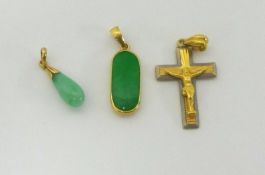 Two jade and gold pendants and a gold cross (3).