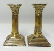 A pair silver column candlesticks.