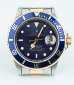 Rolex, a Gents steel and gold Submariner Oyster Perpetual Date wrist watch.