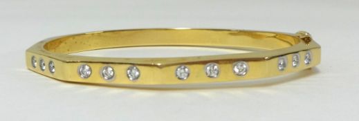 An 18k diamond set bangle, approx 0.60 carats, clarity judged to be VVS1/VVS2, colour G/H.