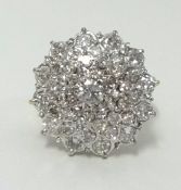 An 18ct gold diamond cluster ring, (with copy of insurance valuation at £3,595), finger size O.