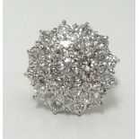 An 18ct gold diamond cluster ring, (with copy of insurance valuation at £3,595), finger size O.