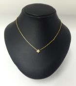 An 18ct gold chain, with a pendant set with a single diamond, stamped 750. approx 6.90gms.
