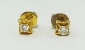 A pair of diamond set earrings in yellow gold, stamped .850.
