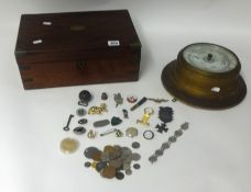 A collection of various badges, general coins, Gamage ,London aneroid barometer and a military