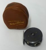 A Hardy Fishing Reel, The St. George, cased, 2 9/16th diameter.