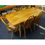 Ercol a light elm wood dining table and six chairs