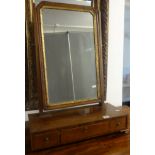 A 19th century mahogany dressing table mirror fitted with three drawers, a gilt framed mirror with