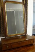 A 19th century mahogany dressing table mirror fitted with three drawers, a gilt framed mirror with