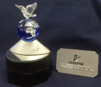 Swarovski Crystal Glass Crystal Planet Collection Dove of Peace on a rotating stand.