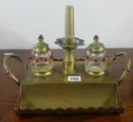 An ornate brass and glass inkstand