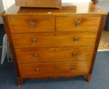 A 19th century mahogany chest of drawers on splayed bracket feet and reeded sides.