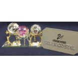 Swarovski Crystal Glass Three Paperweights on a mirror base, comprising SCS Swan on gold stand,