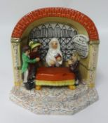 A Staffordshire figure group 'The New Marriage Act', in concave arch and stepped base,