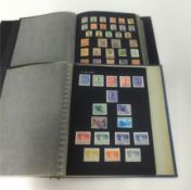 A collection of World Stamps in four albums.