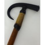 A Malacca walking stick with carved handle inscribed 'Schynige Platte?'