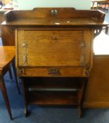 An Arts & Crafts style oak bureau and a side chair