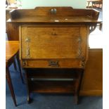 An Arts & Crafts style oak bureau and a side chair