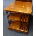 A mahogany and inlaid revolving bookcase