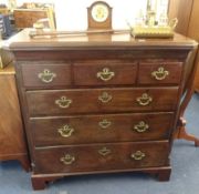 A Georgian mahogany chest of drawers, fitted with six drawers, canted corners, bracket feet and