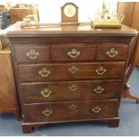 A Georgian mahogany chest of drawers, fitted with six drawers, canted corners, bracket feet and