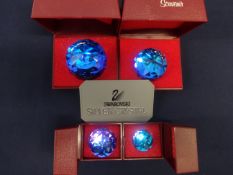 Swarovski Crystal Glass. Collection of Four Crystal Paperweights of different sizes with blue colour