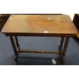 An antique cane and rattan folding Colonial day bed also a Victorian side table with turned