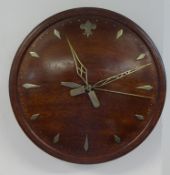 Electric clock reputedly made from wood from the captains doors off H.M.S.Illustrious with silver