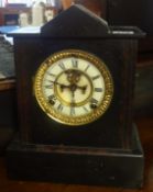 A Victorian slate mantle clock, with escapement window in the dial, with key a/f.