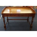 A Victorian mahogany washstand, with 3/4 low gallery, fitted with two drawers on turned legs