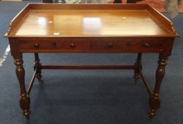 A Victorian mahogany washstand, with 3/4 low gallery, fitted with two drawers on turned legs