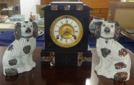 A pair of Staffordshire dogs, and a slate and marble cased mantle clock
