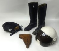 A Russian Pilots helmet, a pair leather Russian boots, a leather flying hat and a pistol holster