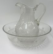A large early 20th century glass jug and basin set