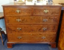A 19th century mahogany chest of drawers, crossbanded and inlaid on bracket feet.